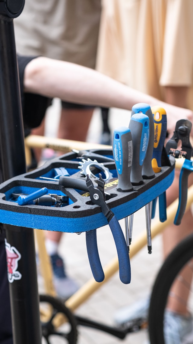 Bike tools organized on a workshop rack